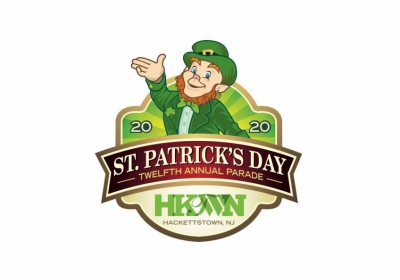 Leprechaun waving for Hackettstown's St. Patrick's Day parade